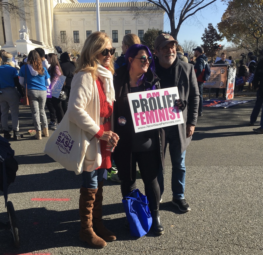 New Wave Feminists at pro-life rally outside U.S. Supreme Court as Dobbs case is argued 